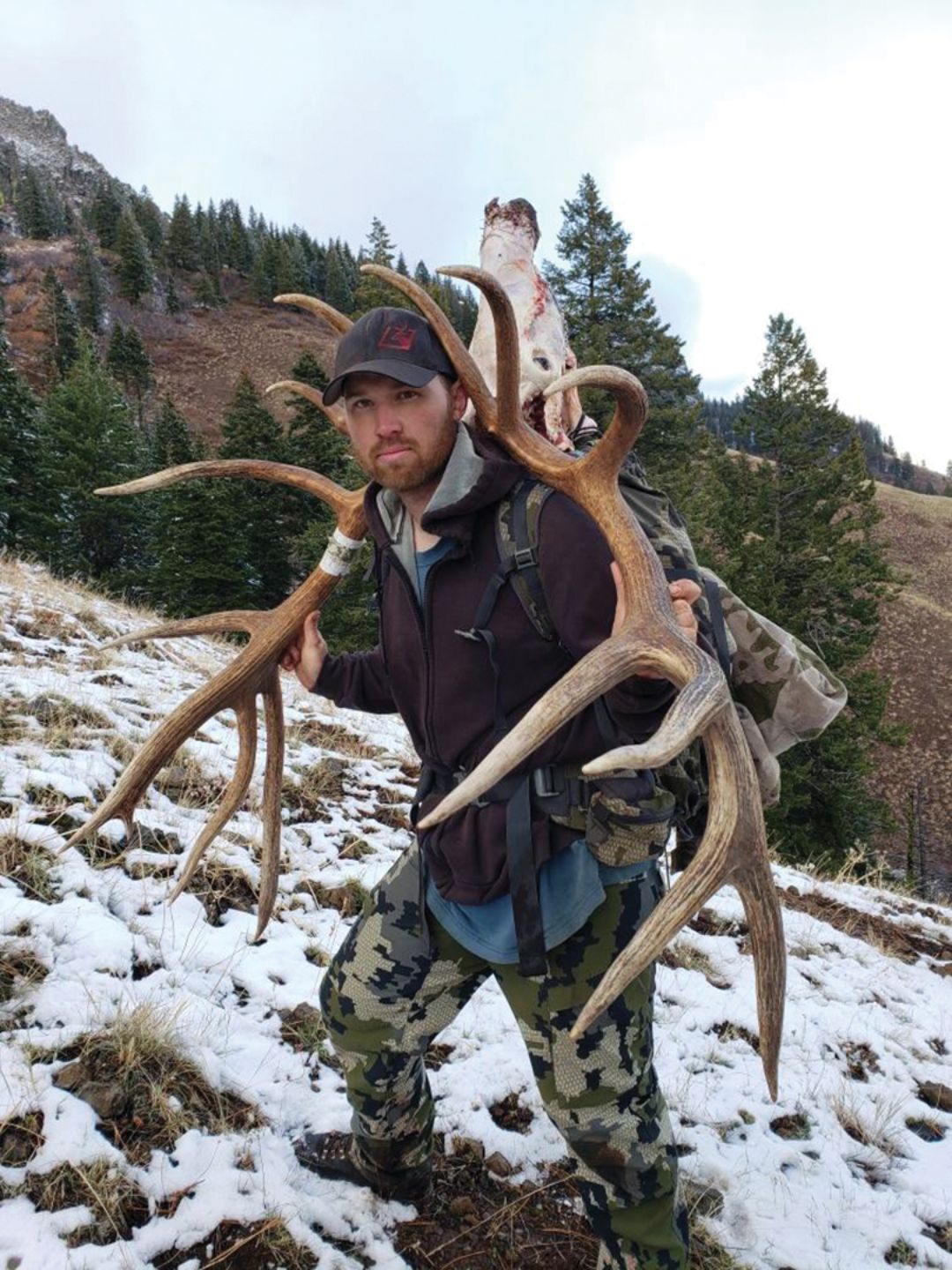 Guide Andrew Tenneson heard the rumor that the “Face” bull had been taken. Following Freeman’s tracks down the ridge, he arrived to help with the pack out.